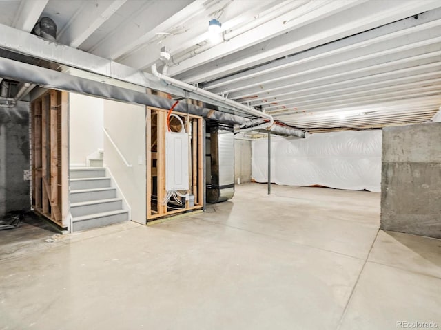 unfinished below grade area with heating unit and stairway