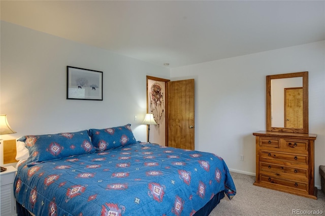 bedroom featuring light colored carpet