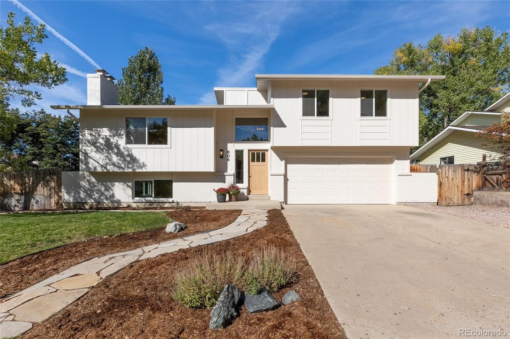 bi-level home featuring a garage