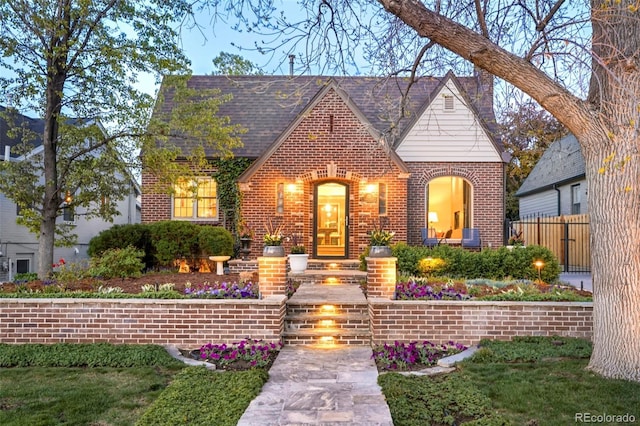 628 Cherry St, Denver, CO 80220 - tudor house featuring brick siding and fence