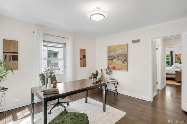 628 Cherry St, Denver, CO 80220 - home office with plenty of natural light, dark wood-type flooring, and baseboards