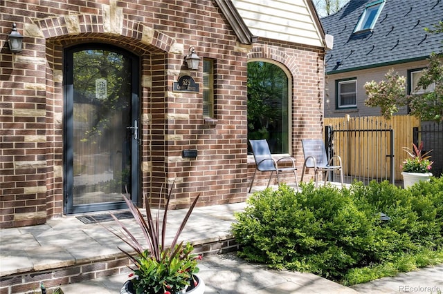 628 Cherry St, Denver, CO 80220 - entrance to property featuring brick siding and fence