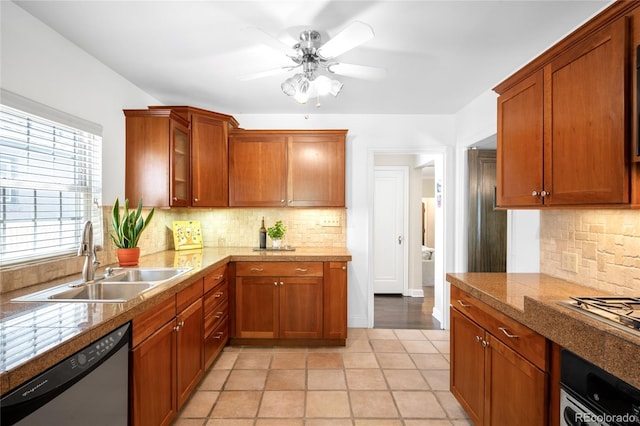 628 Cherry St, Denver, CO 80220 - kitchen featuring appliances with stainless steel finishes, a sink, decorative backsplash, and ceiling fan