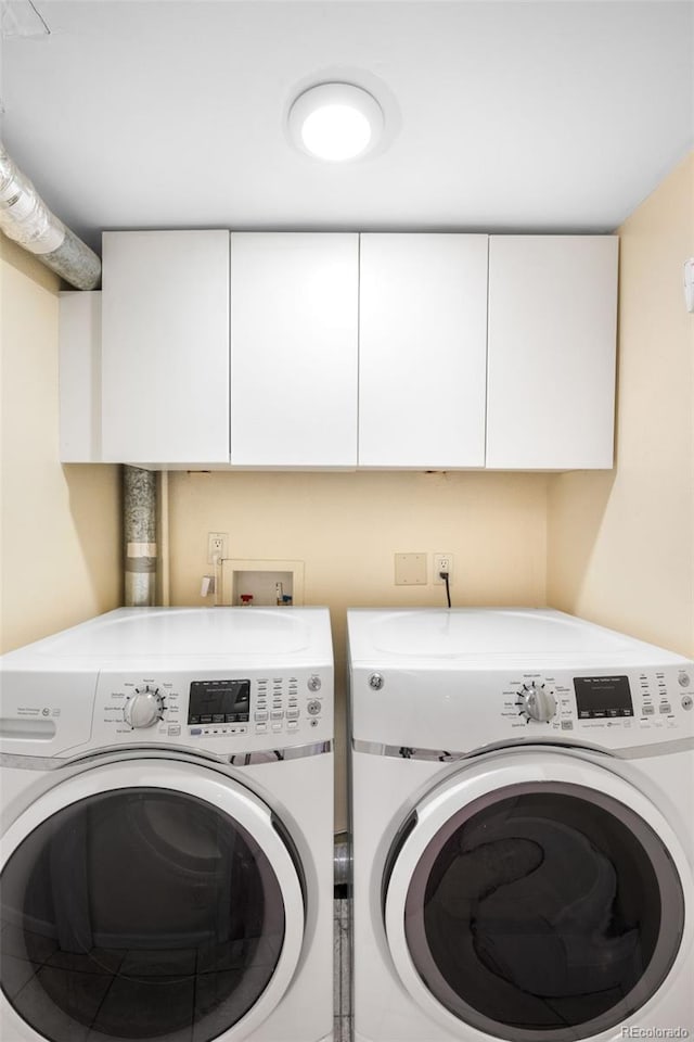628 Cherry St, Denver, CO 80220 - washroom with cabinet space and separate washer and dryer