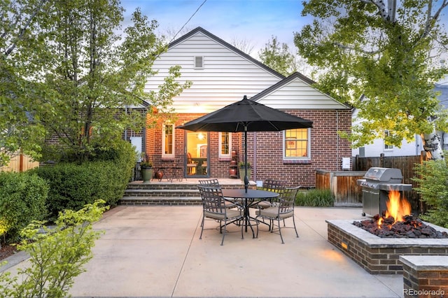 628 Cherry St, Denver, CO 80220 - view of patio / terrace with a fire pit, a grill, fence, and outdoor dining space