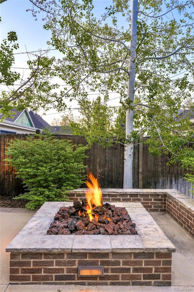 628 Cherry St, Denver, CO 80220 - view of patio featuring an outdoor fire pit and a fenced backyard