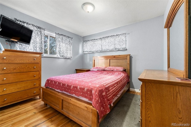 bedroom featuring wood-type flooring