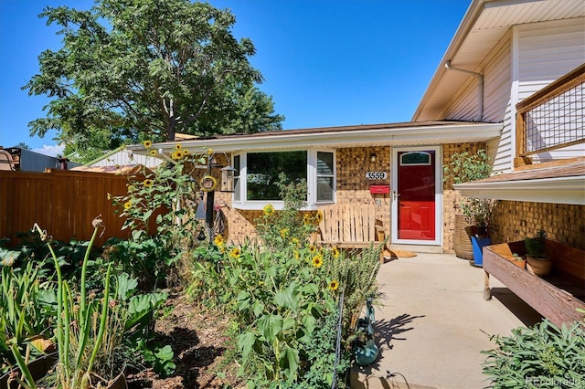 property entrance with a patio area