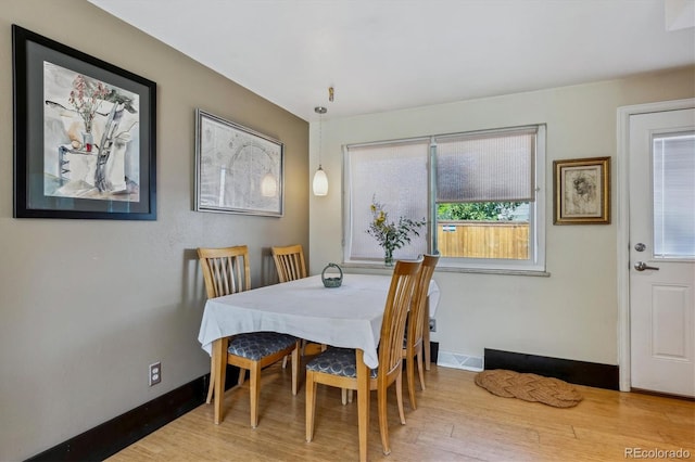 dining area with wood-type flooring