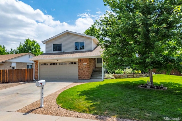 view of front of property featuring brick siding, concrete driveway, a front lawn, and fence