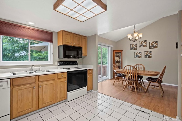 kitchen with black microwave, light countertops, electric stove, white dishwasher, and a sink