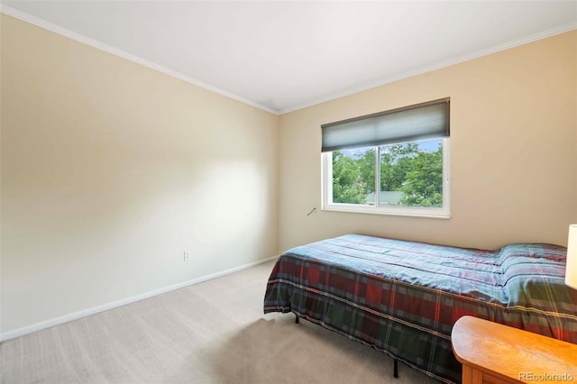 bedroom with baseboards, carpet floors, and ornamental molding