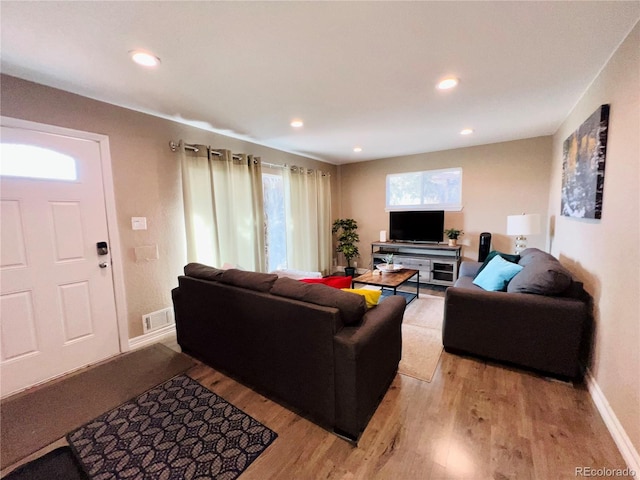 living room with light hardwood / wood-style floors