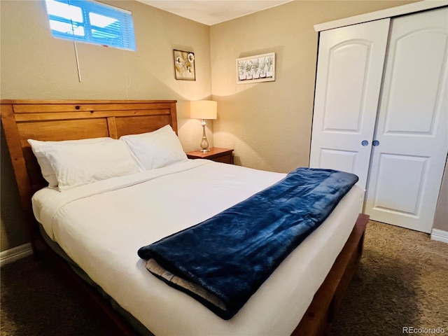 carpeted bedroom featuring a closet