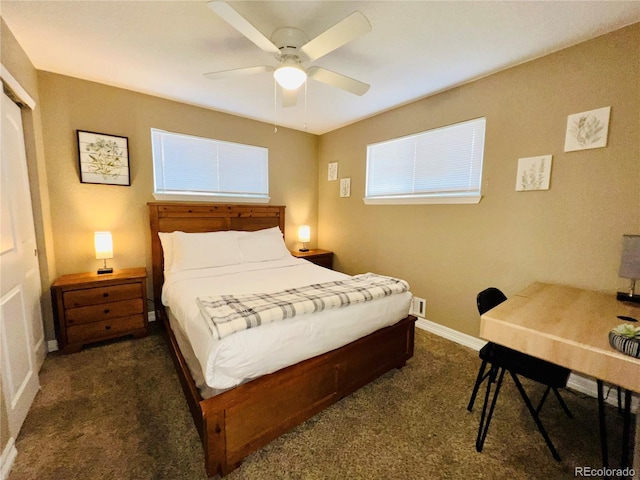 carpeted bedroom with ceiling fan and a closet