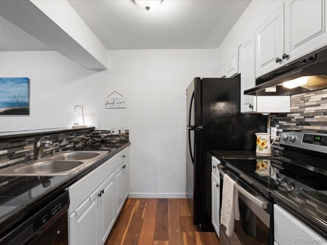 kitchen featuring stainless steel electric stove, under cabinet range hood, black dishwasher, a sink, and backsplash