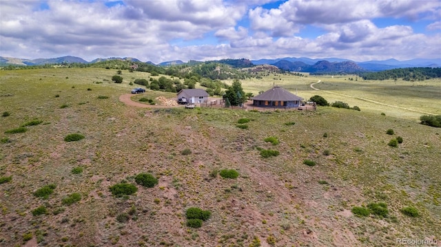 aerial view with a mountain view and a rural view