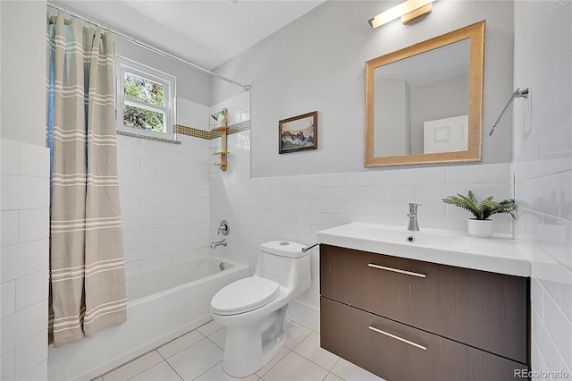 full bathroom with tile walls, tile patterned flooring, vanity, and toilet