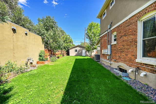 view of yard featuring central air condition unit