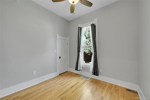 unfurnished room featuring light hardwood / wood-style floors and ceiling fan