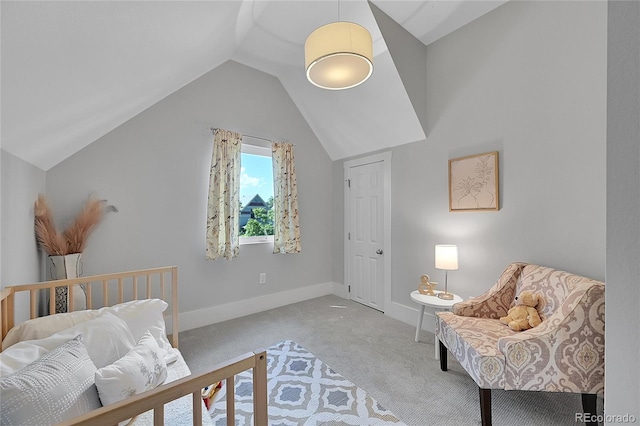 carpeted bedroom featuring lofted ceiling