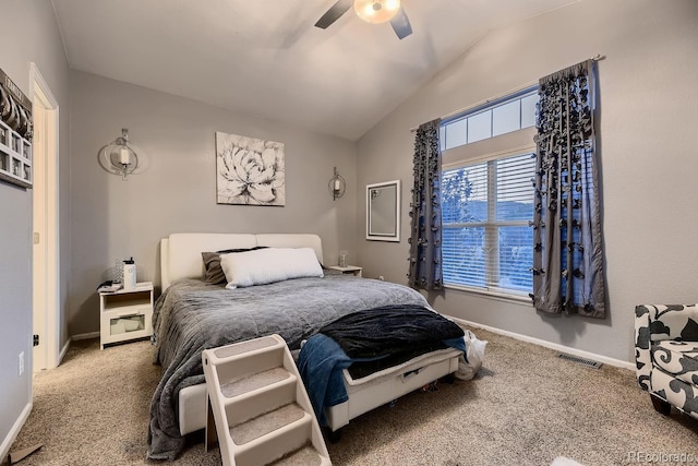 carpeted bedroom featuring ceiling fan and lofted ceiling