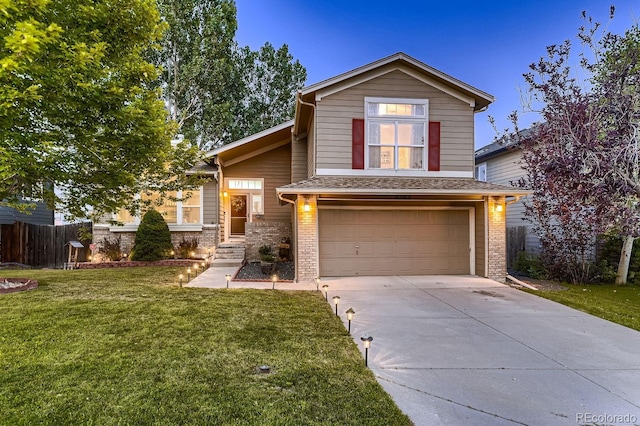 view of front of house featuring a front yard and a garage