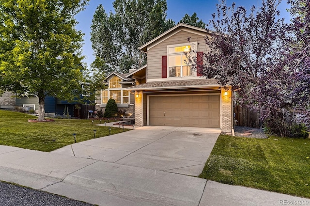 view of front facade with a garage and a front lawn