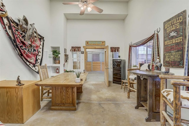 office space featuring ceiling fan and beverage cooler