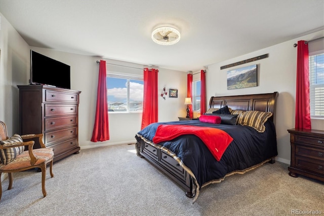 bedroom with carpet floors and baseboards
