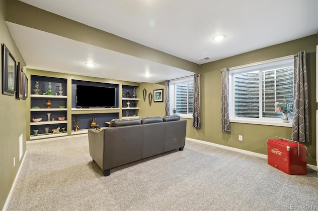 carpeted living room featuring built in features, baseboards, visible vents, and recessed lighting