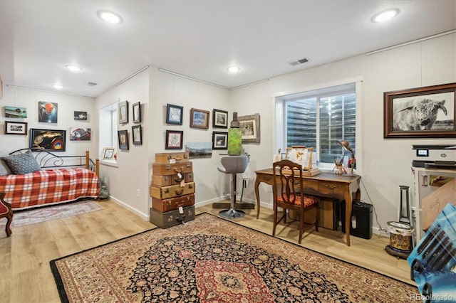 bedroom with baseboards, recessed lighting, visible vents, and wood finished floors