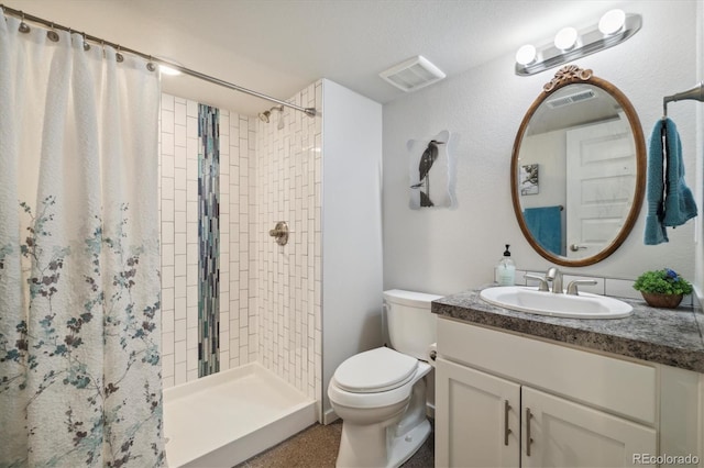 full bath featuring vanity, toilet, and a shower stall
