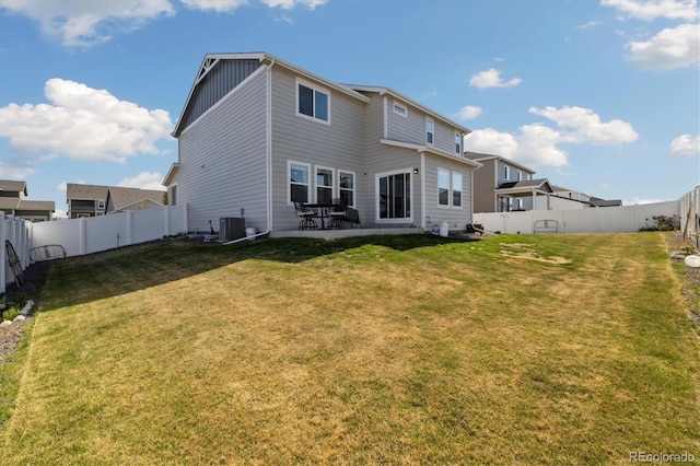 rear view of property with central air condition unit, board and batten siding, a yard, and a fenced backyard