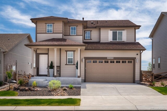 9389 Mayflower Gulch Way, Colorado Springs, CO 80927 - view of front of home with an attached garage, driveway, and a shingled roof