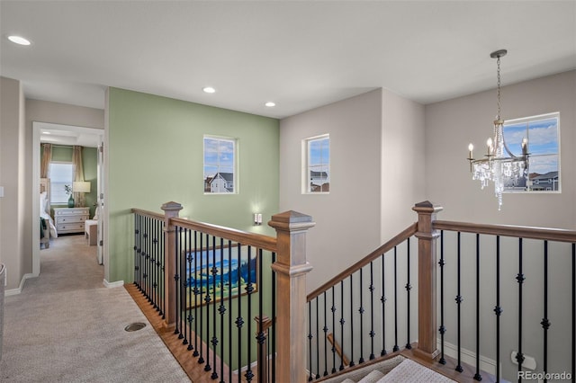 9389 Mayflower Gulch Way, Colorado Springs, CO 80927 - stairs with recessed lighting, plenty of natural light, a chandelier, and carpet