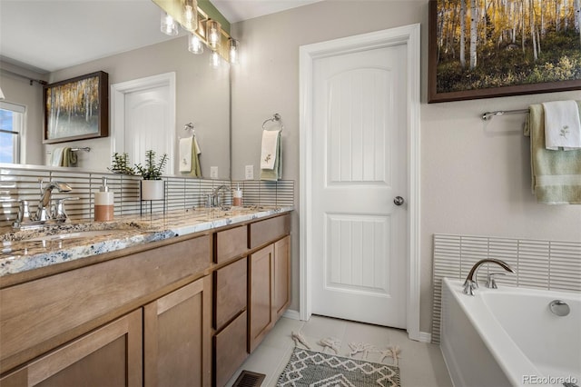 9389 Mayflower Gulch Way, Colorado Springs, CO 80927 - full bath featuring double vanity, a bath, decorative backsplash, and tile patterned floors