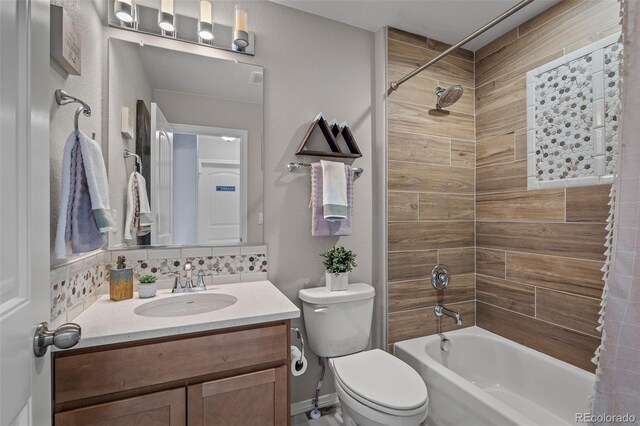 9389 Mayflower Gulch Way, Colorado Springs, CO 80927 - bathroom featuring vanity, shower / bath combo with shower curtain, and toilet