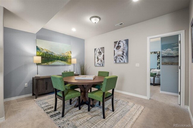 9389 Mayflower Gulch Way, Colorado Springs, CO 80927 - dining space with light carpet, baseboards, and recessed lighting