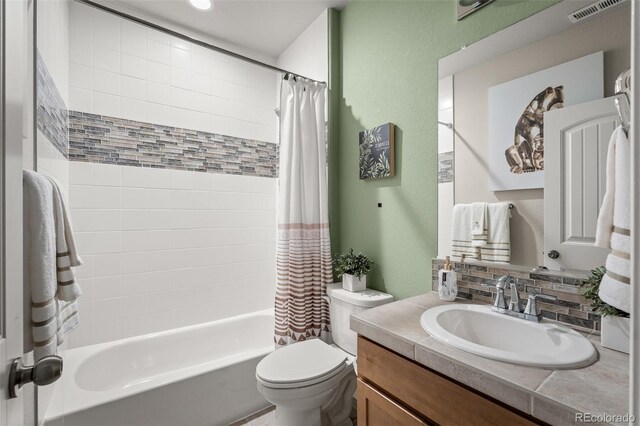 9389 Mayflower Gulch Way, Colorado Springs, CO 80927 - full bathroom with vanity, toilet, and shower / bathtub combination with curtain