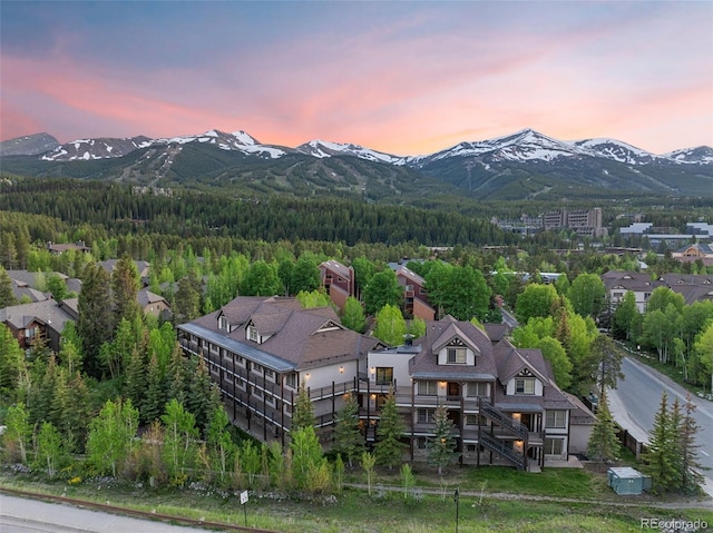 33 Broken Lance Dr Unit 207S, Breckenridge, CO 80424 - aerial view of property and surrounding area with a mountainous background and a heavily wooded area