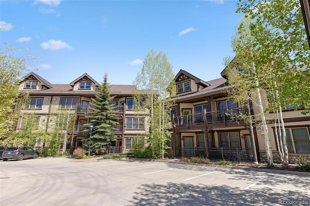 33 Broken Lance Dr Unit 207S, Breckenridge, CO 80424 - view of building exterior featuring uncovered parking