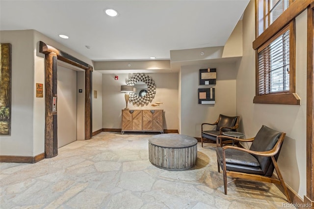 33 Broken Lance Dr Unit 207S, Breckenridge, CO 80424 - living area featuring elevator, stone flooring, and recessed lighting