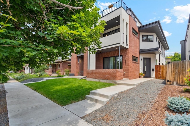 2244 S Lincoln St, Denver, CO 80210 - modern home featuring brick siding, a balcony, and stucco siding