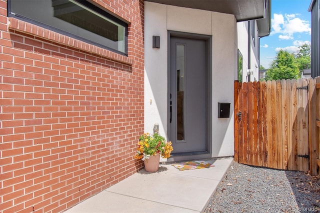 2244 S Lincoln St, Denver, CO 80210 - property entrance with brick siding, stucco siding, and elevator