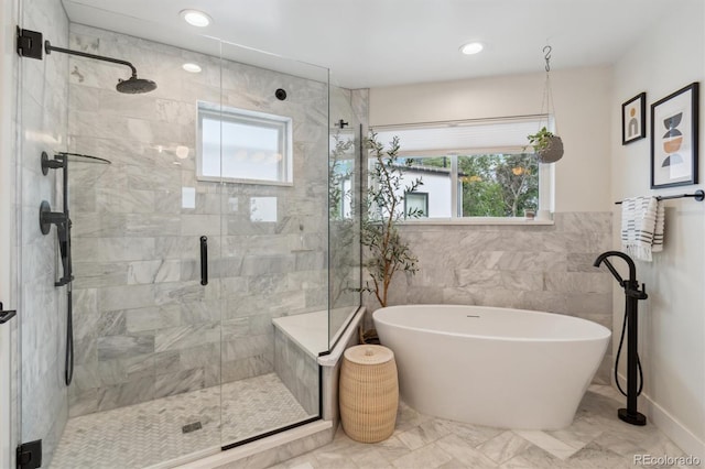 2244 S Lincoln St, Denver, CO 80210 - full bathroom with a freestanding tub, a shower stall, tile walls, marble finish flooring, and recessed lighting