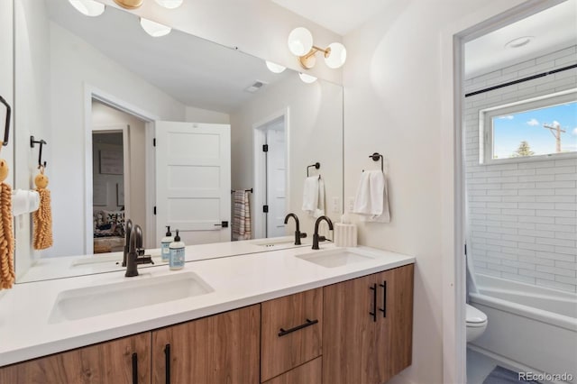 2244 S Lincoln St, Denver, CO 80210 - full bath with double vanity, toilet, and shower / tub combo