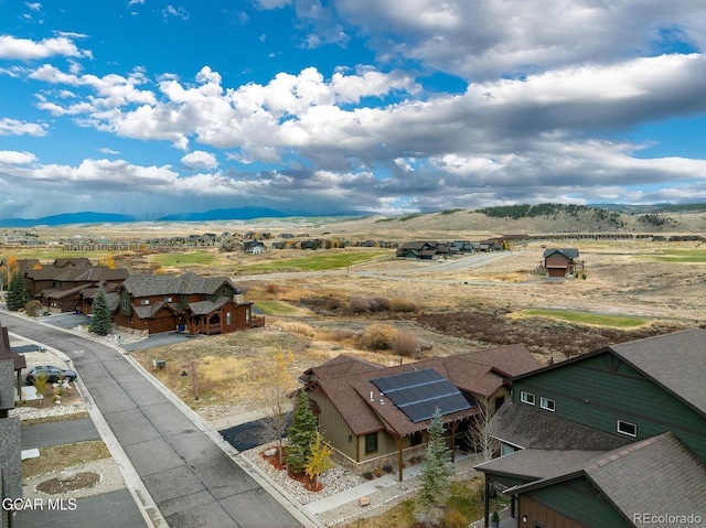 drone / aerial view featuring a mountain view