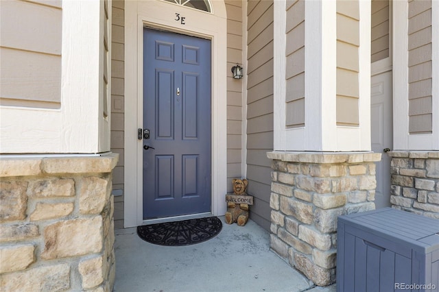 4251 S Blackhawk Cir Unit 3E, Aurora, CO 80014 - view of exterior entry with stone siding and covered porch