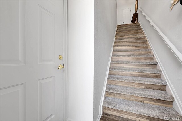 4251 S Blackhawk Cir Unit 3E, Aurora, CO 80014 - staircase with wood finished floors